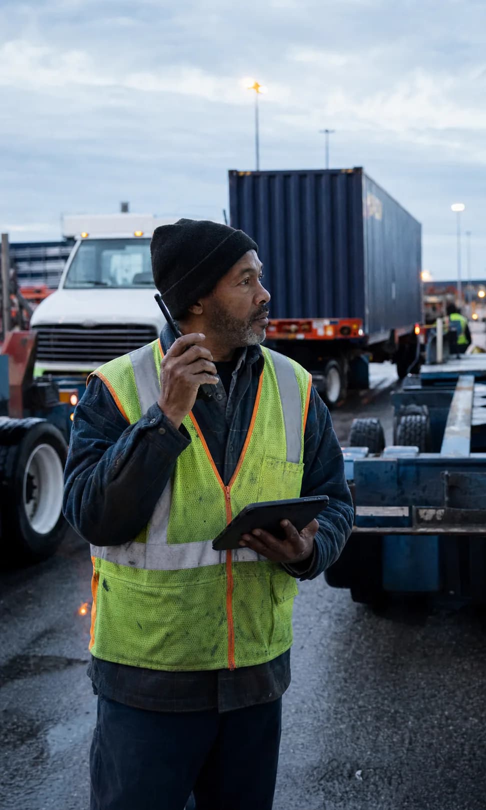 A drayage yard supervisor coordinating equipment at the start of a shift